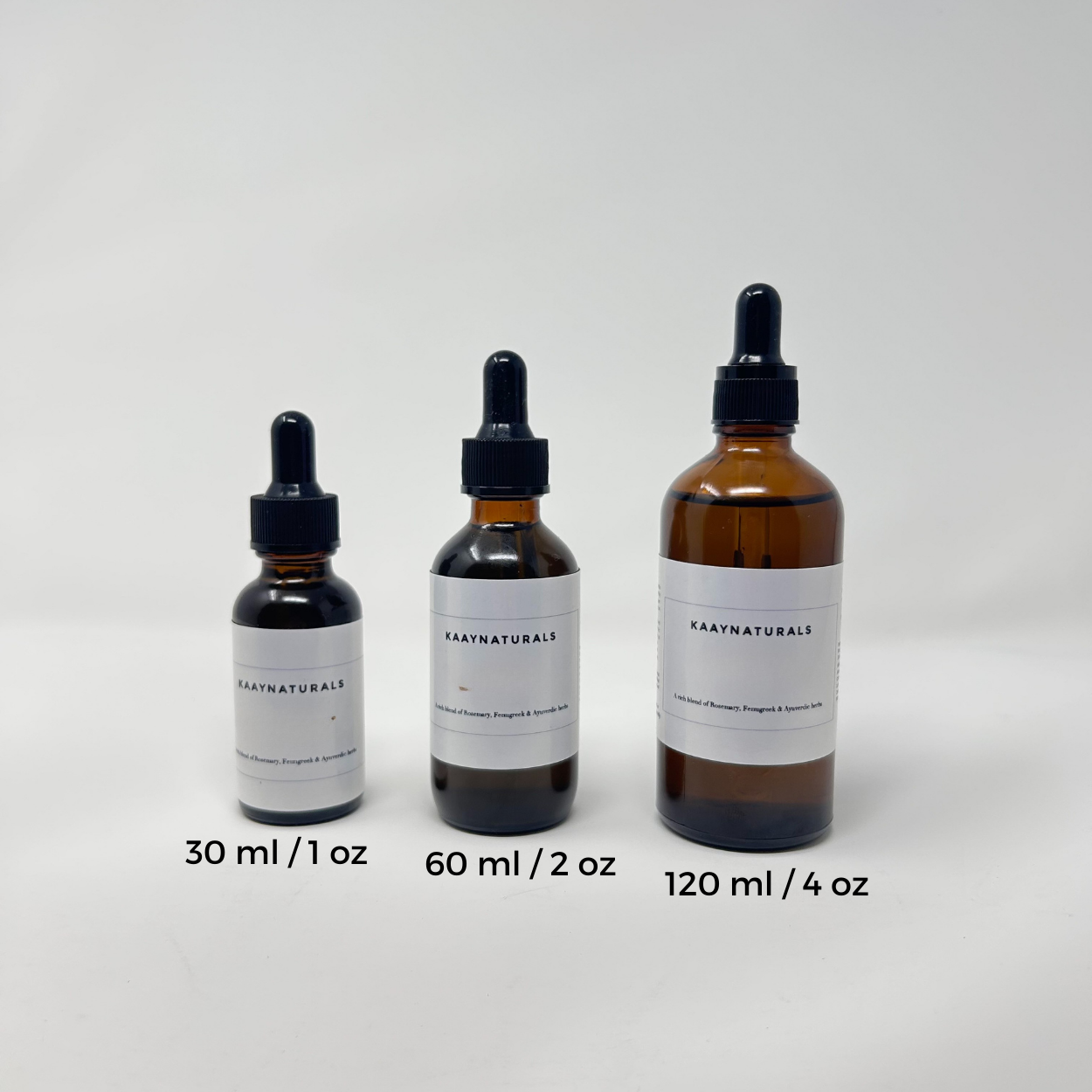 Three bottles of Kaan Naturals with different capacities on a white background