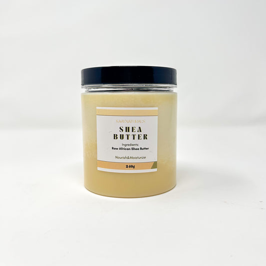 Jar of shea butter with a black lid on a white background