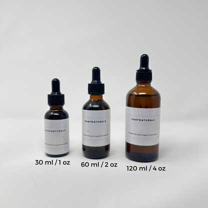 Three bottles of Kaan Naturals with different capacities on a white background